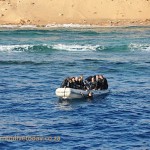 Divers on a Zodiac after a dive
